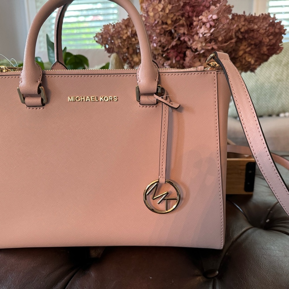 NWT light pink Michael Kors leather satchel with gold trim.